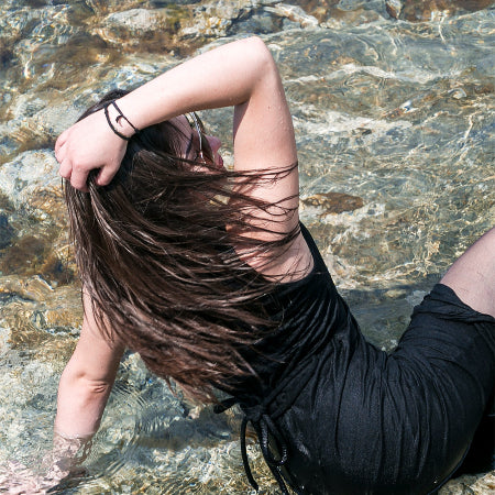 Black dress on sea