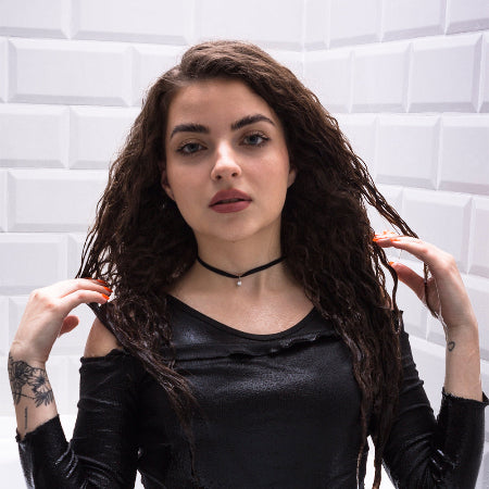 Curly hair and black clothes